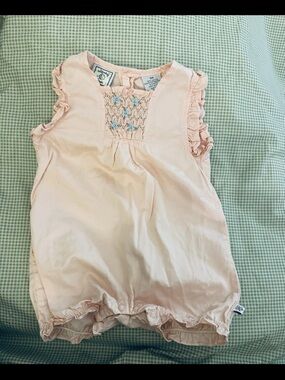 child of mine Pale Pink Smocked Ruffle Romper with Blue Embroidery